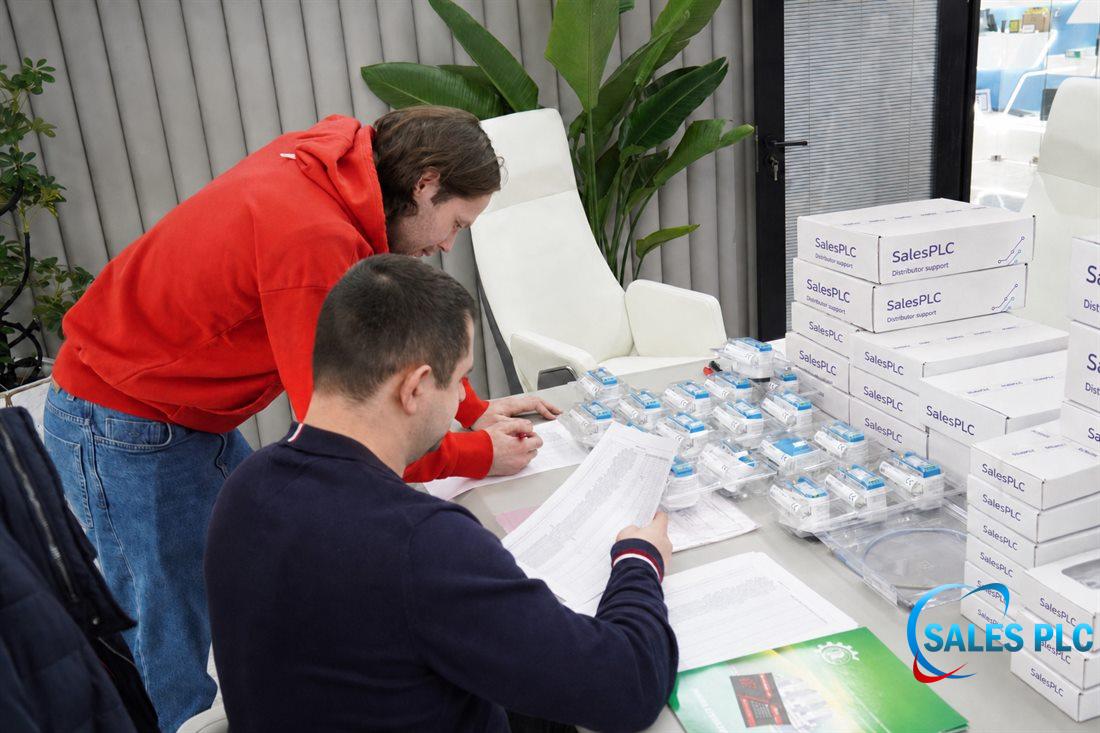 SalesPLC team verifying industrial automation spare parts before shipment