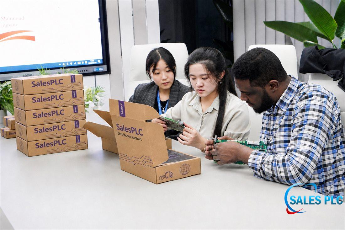 SalesPLC technical team reviewing automation components
